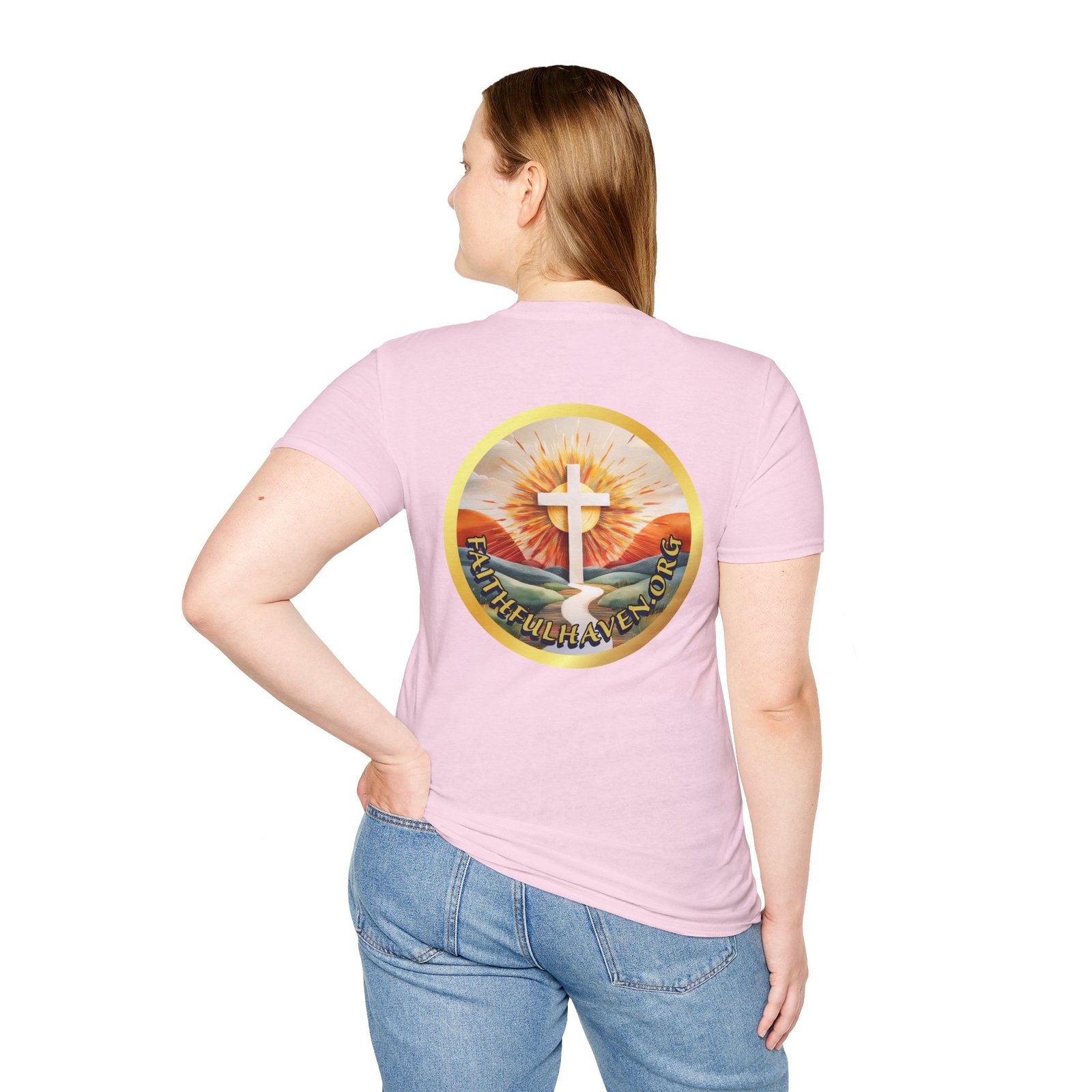 Woman wearing light pink shirt with back logo of faithful haven.